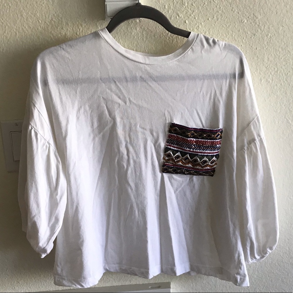 cute puffy sleeve top with a beaded pocket